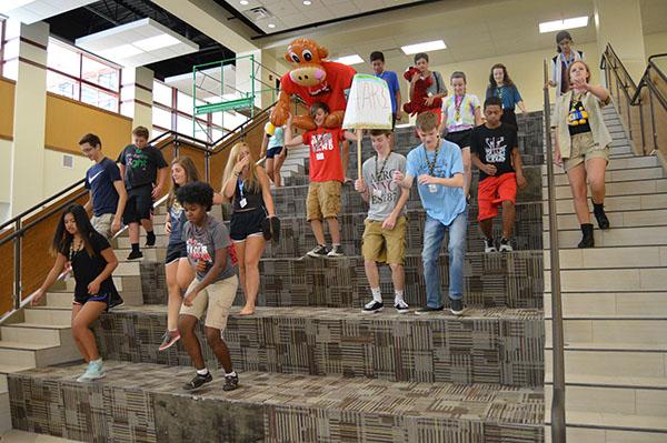 Students play on the gathering stairs in the College and Career Academy during Tiger Fever on July 29. Photo by Jenna Knutson.