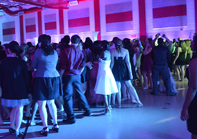 Students dance in the auxiliary gym during homecoming week 2014.