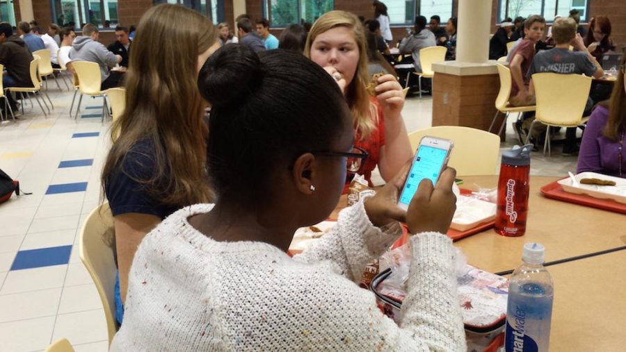 Junior Haven Jackson scrolls through her Twitter feed at lunch on Nov. 17.