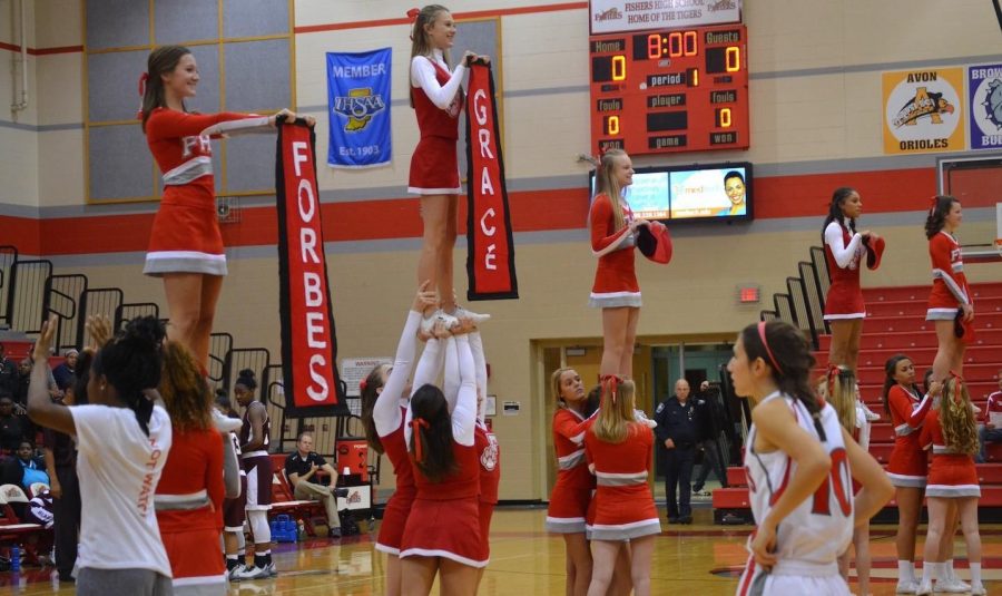 Cheerleaders+welcome+varsity+line+up+during+Lady+Tigers+season+opener+against+Lawrence+Central.+Tigers+win+in+overtime+60-50.+Photo+by+Megan+Jessop