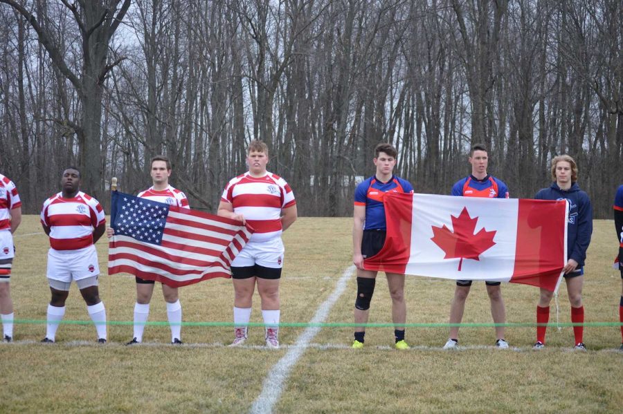 Both+FHS+players+and+Ontario+Vikings+hold+their+home+country+flag+while+singing+the+National+Anthem+and+Canada+National+Anthem.+photo+by+Carolina+Puga+Mendoza+