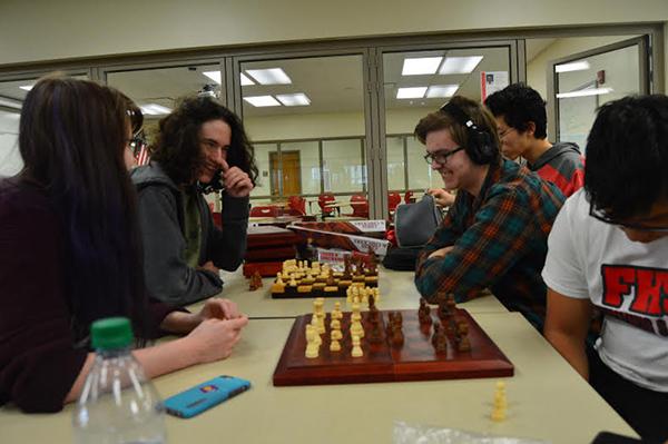 Students (right to left) Pedro Yam, Noah Brandt, Tetsuro Matsumoto Katlyn Murphy and Jacob Frollo enjoy the friendly match after school at room H230 while learning chess tactics and movements on Wed., March 30
Photo by Carolina Puga Mendoza 