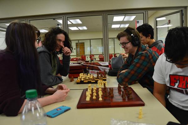 Students (right to left) Pedro Yam, Noah Brandt, Tetsuro Matsumoto Katlyn Murphy and Jacob Frollo enjoy the friendly match after school at room H230 while learning chess tactics and movements on Wed., March 30
Photo by Carolina Puga Mendoza 