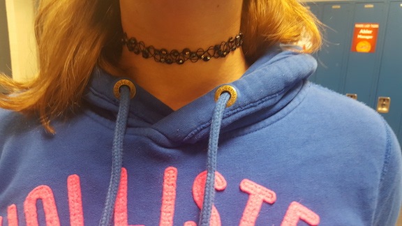 Freshman Rachel Lynch shows off one of her favorite chokers. Photo by Miranda Lewellen