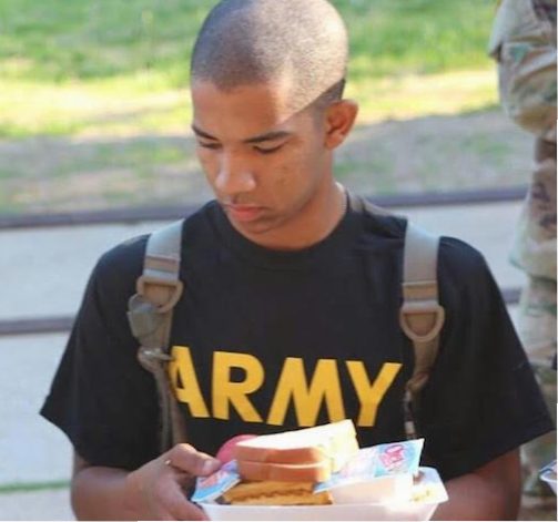 Senior Tony Jenkins holds a plate of food at military training camp. Photo courtesy of Tony Jenkins. 