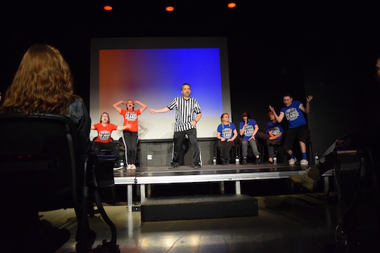 Comedy Sportz sponsor Jon Colby referees a match on Jan. 26. Photo by Jenna Knutson.