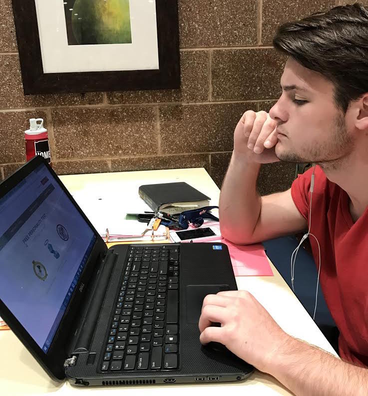Junior Blake Pereria, who currently has an undecided career plan, takes the Myers-Briggs Personality test in study hall on Thursday, April 26. Photo by Sawyer Osmun. 
