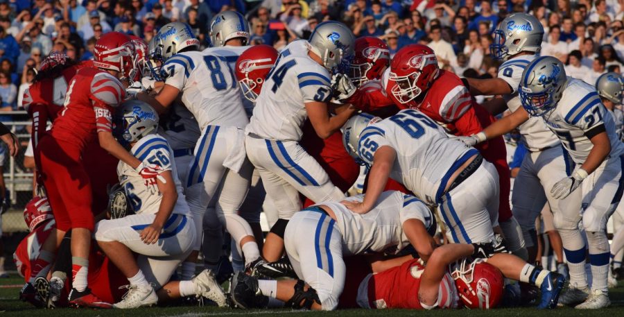 The+Royals+fight+to+push+their+ball+carrier+a+few+feet+forward+at+the+Varsity+Mudsock+football+game+on+September+8%2C+the+finale+of+the+week.+Photo+by+Kaylee+Demlow.