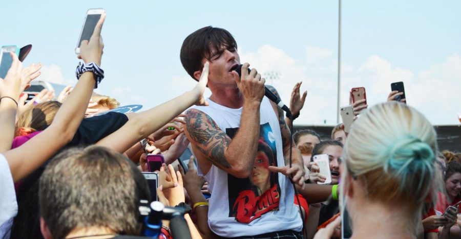 Drake+Bell+sings+amongst+students+and+cell+phones+during+his+final+act+of+the+concert+in+the+parking+lot+on+Sept+22.+Photo+by+Helen+Rummel.