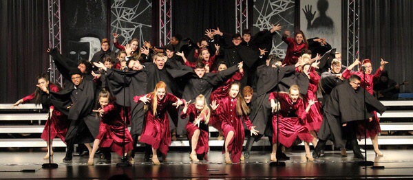 Electrum, the mixed show choir, previews the opening of its show for parents on Jan. 26. In their competition season they will use a fog machine. Photo used with permission of Lily Wann.