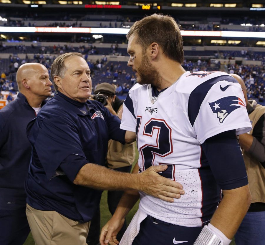 After winning a game in Indianapolis in 2015, coach Bill Belichick congratulates Tom Brady.
