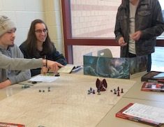 Senior Liam Green runs a small Dungeons and Dragons campaign at a club meeting on March 15. 