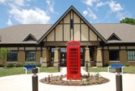 A classic red phone booth in Billericay Park honors Fisherss English sister city.