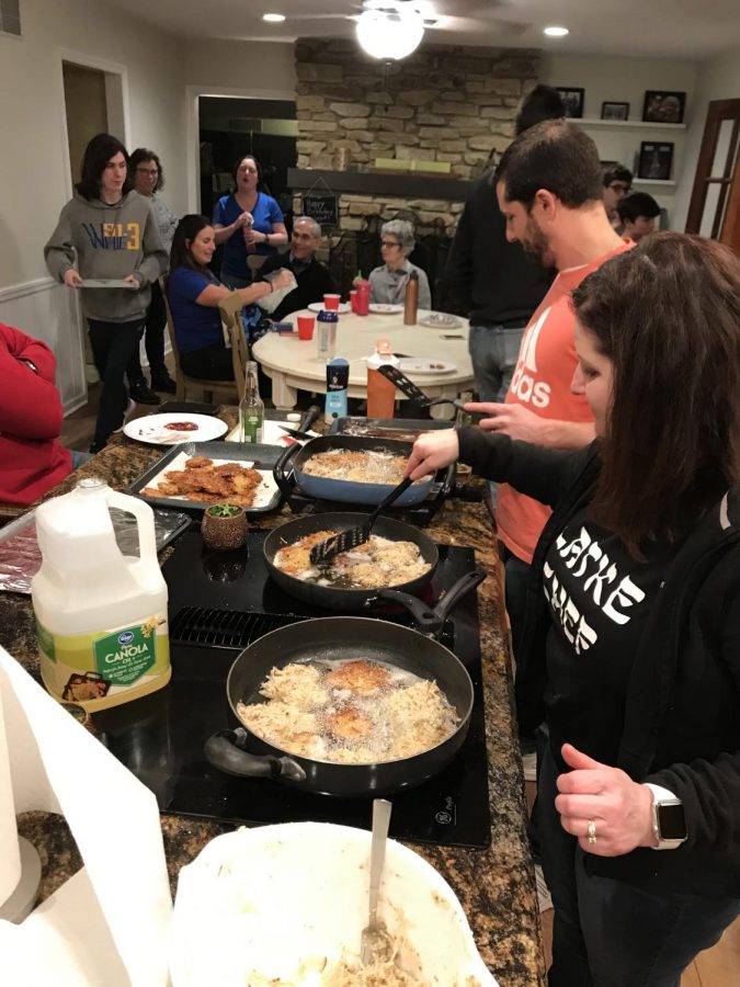 While celebrating Hanukkah on Nov. 28, senior Hannah Moore and her extended family make and enjoy latkes, which are potato pancakes fried in oil. 