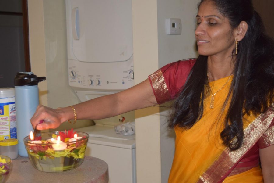 Yogini Dharmadhikari lights up decorations around the house as the sun sets.Diwali was celebrated on Nov. 4. 2022.