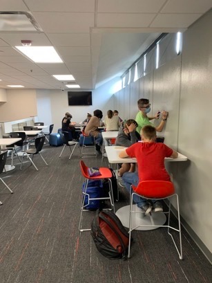 Weekly meeting at Fishers Junior High on Thursday, Dec. 9 as students gather around for help from FHS students and Mrs. O’Neal. 