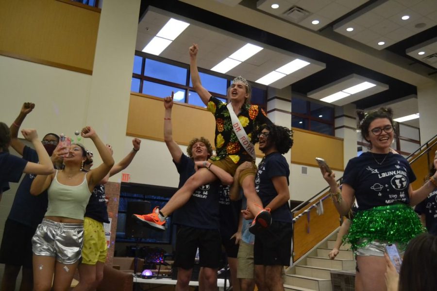 Seniors+Paul+Kelley+and+Usmaan+Saifuddin+lift+Kyle+Boatman+on+their+shoulders+after+he+is+crowned+as+Dance+Marathon+Royalty+on+March+25.+