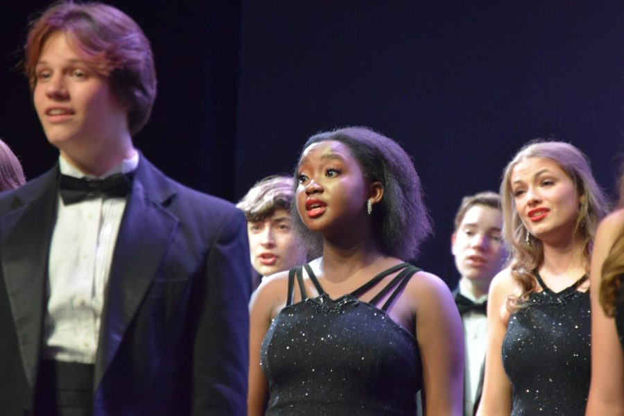 Junior Cory Wilcher, sophomores Daniel Hobart, Wangechi Mwangi, Justin Zeisig and senior Kalista Foster sing “The Music of Living” by Dan Forrest as a part of Electrum’s set. The spring concert was on Saturday, May 14.