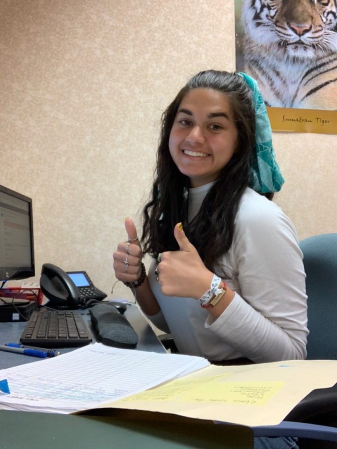 On April 20, senior Kirah Fuller works on entering voicemails for the absences that day during her internship for the Fishers High School attendance office. “I like that I have downtime to complete tasks and do homework while making money,” Fuller said. 