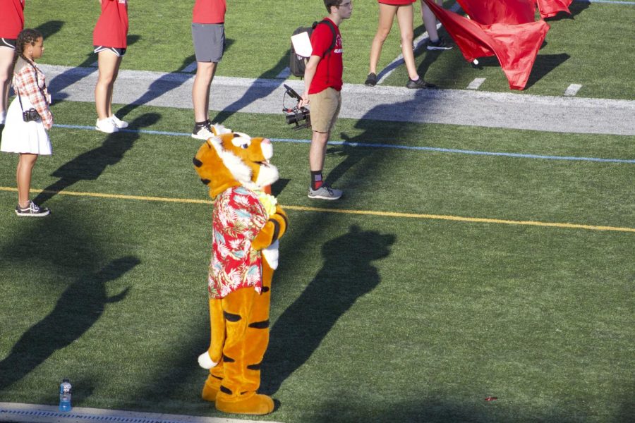 Rumble the Tiger joins the crowd for the National Anthem. “I expected that the game wouldn’t be interesting and that we would just hang out with a few people, but it was really interesting to watch and hang out with everyone around us.” Quinn said.