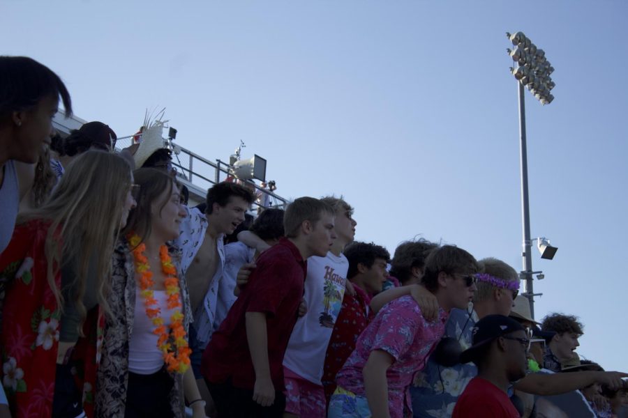 The student section wears leis and Hawaiian shirts while chanting “We ready?” “The energy of the student section was very high, everyone was having a good time,” freshman Laureli Quinn said.