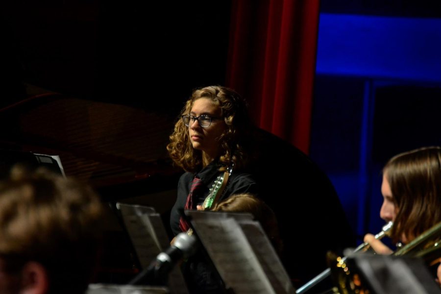Sophomore Kate Armey plays her bass with the Advanced Jazz band. The fall jazz concert took place on Oct. 10, 2022 at Fishers High School. 