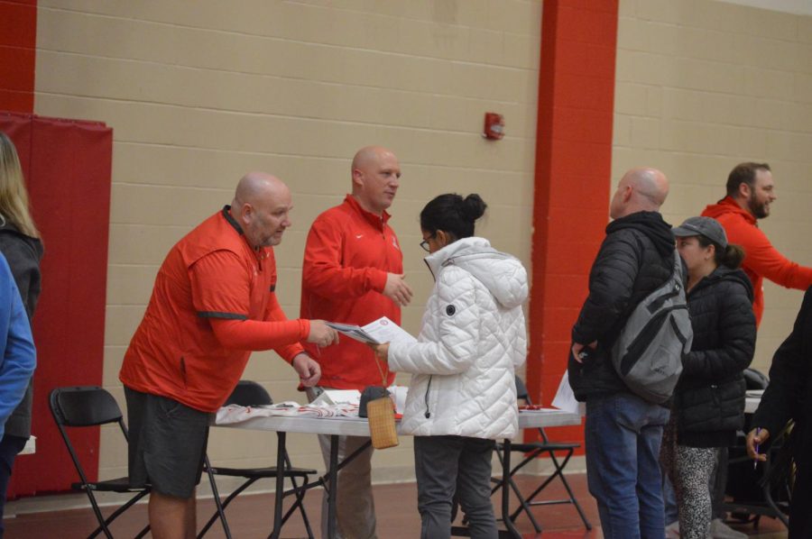Baseball coaches Matthew Cherry and Chris Hebert speak with parents about the program that includes a varsity team and two junior varsity teams. Eighth-grade parent night took place Feb. 1.