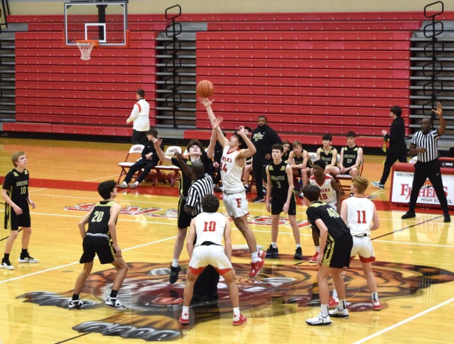 FHS+freshman+basketball+team+winning+the+tip+off+at+the+start+of+their+game+against+Noblesville.
