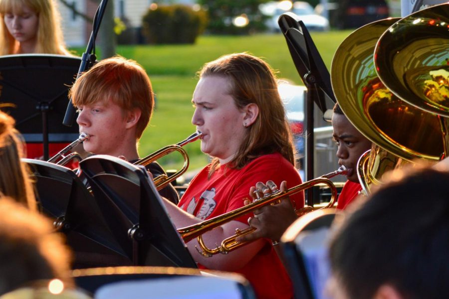 Symphonic Gold Band trumpets, sophomore Jonathan Erickson, senior Gavin Bouchey and sophomore Jason Pettigrew, playing the piece “Disney Blockbusters.” The spring band concert took place on Wednesday, May 18 at Nickleplate Amphitheater.