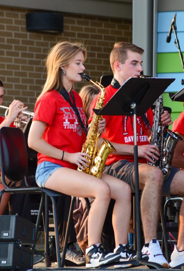 Symphonic Gold Band saxophones, sophomore Alexa Kinnard and junior Dylan Brown, playing the piece “Incredibles.” The spring band concert took place on Wednesday, May 18 at Nickleplate Amphitheater.
