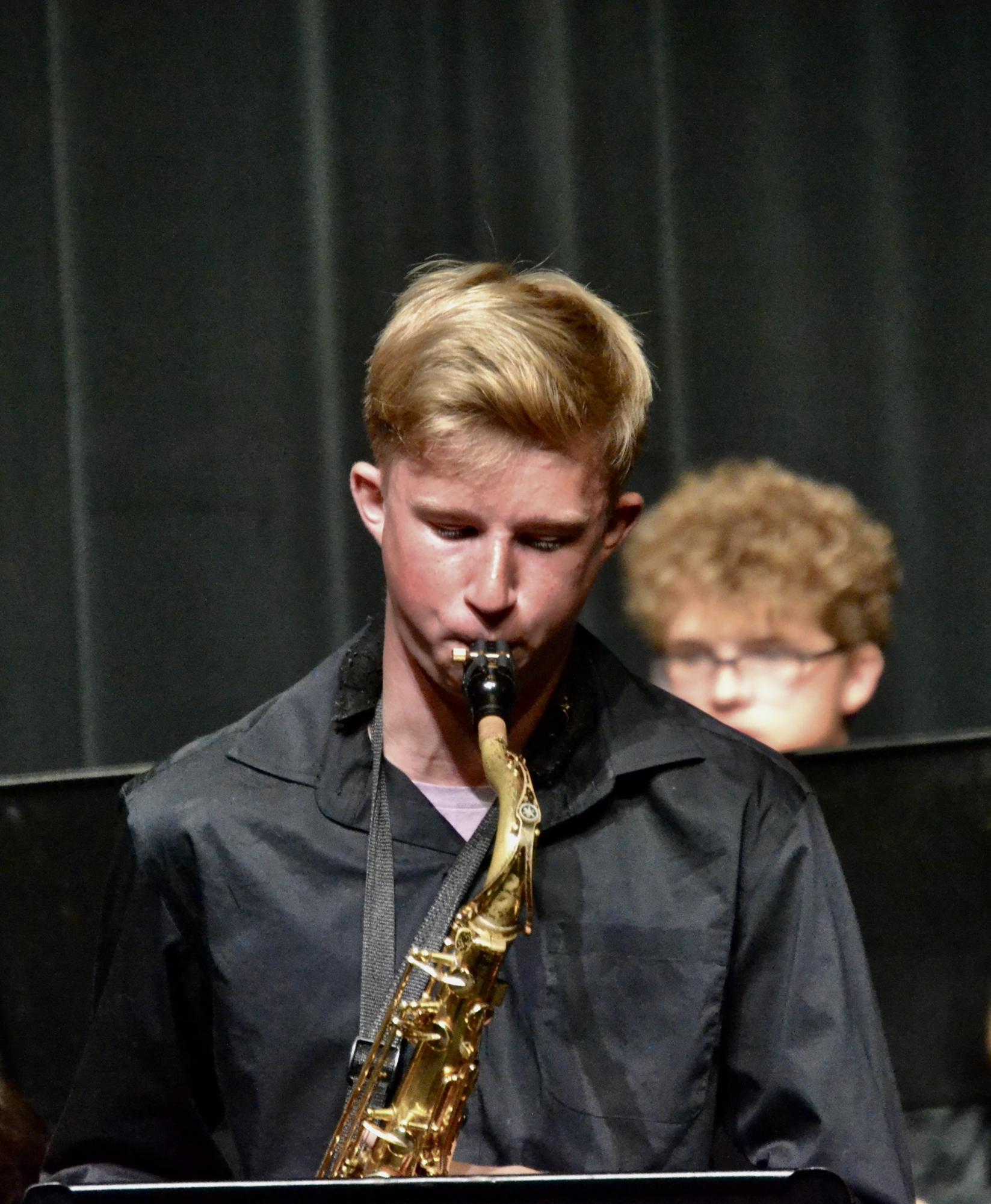 Sophomore Chase Jackson soloing in the piece “Cool Joe, Mean Joe (Killer Joe)” during the intermediate jazz performance. The fall jazz concert occurred on Oct. 4, 2023, in the FHS Auditorium.