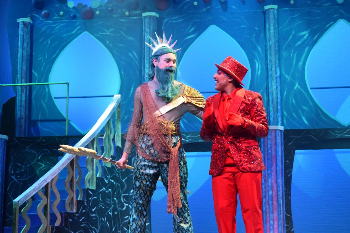 Senior Jack MacGregor (King Triton) and senior Alexander Walton (Sebastian) take the stage during a dress rehearsal for The Little Mermaid musical during TI on Nov. 19.