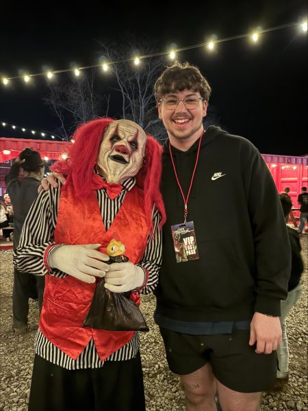 Fishers 2022 graduate Chase Carpenter stands with one of the actors at Indy Scream Park on Oct.25. Photo used with permission of Jolie Carolan.