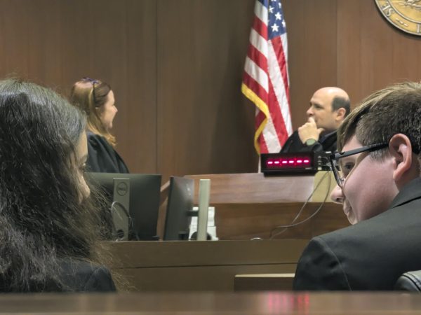 Sila Aysin (Left) and Sam Strawhacker (Right) looking at each other during the Mock Trial competition on Saturday, Feb. 22.