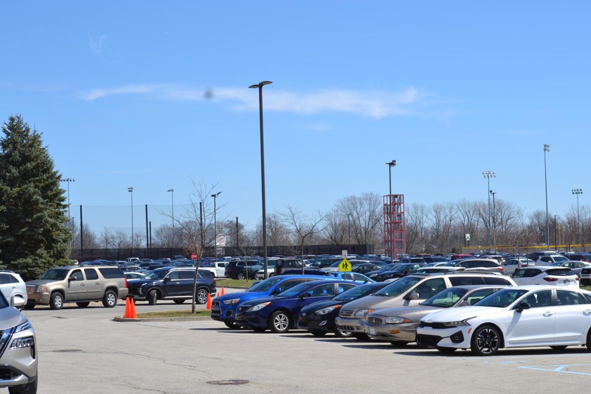 FHS parking lot during the school day with vehicles driven by students and staff