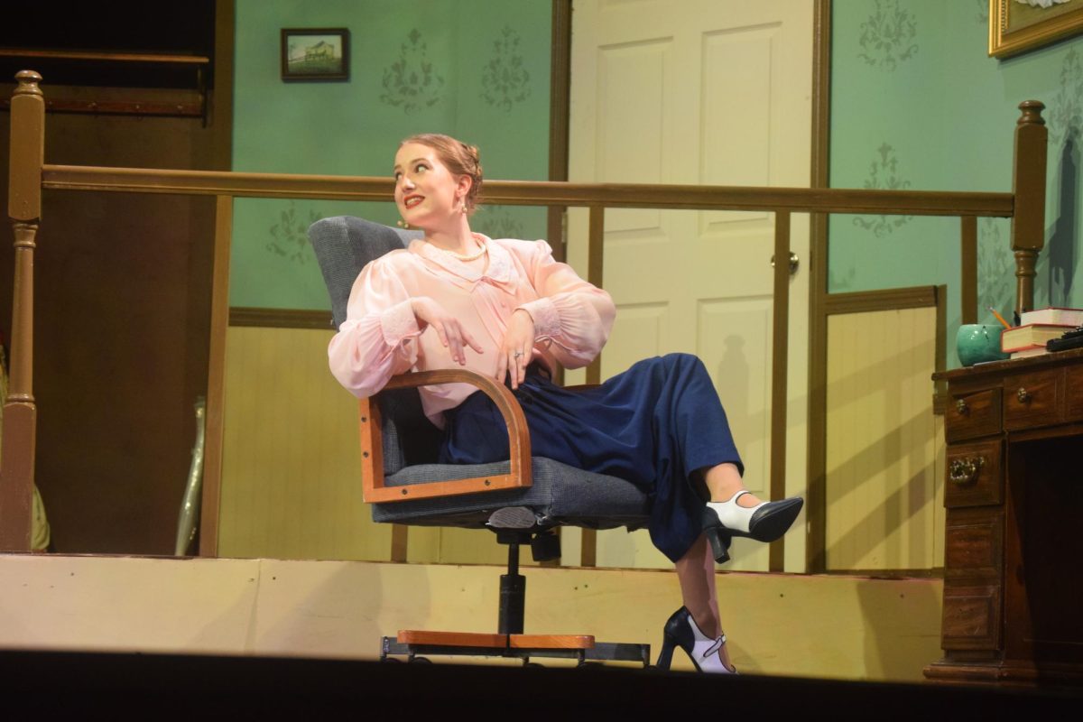 At the FHS play rendition of “You Can’t Take It with You," senior Ellie Adamson reclines in a chair on March 29.  