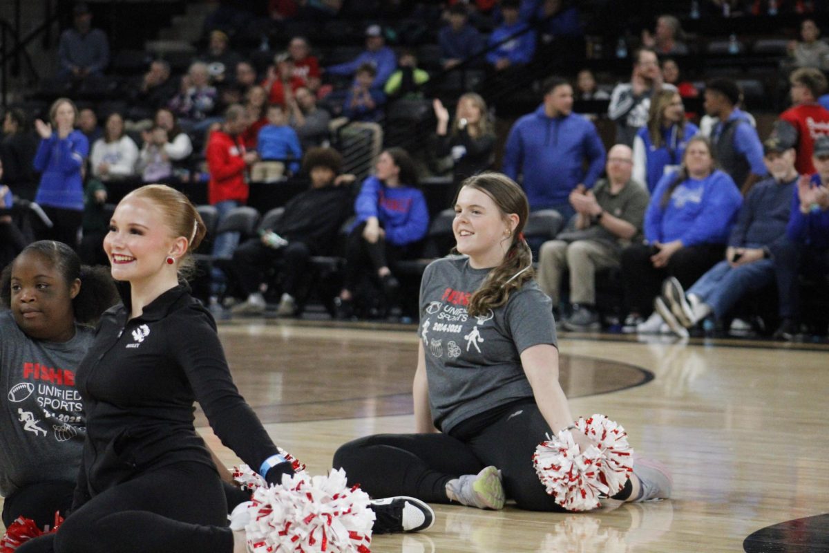 Sophomore Ainsley MacGregor performs with the Unified Dance team during halftime at the Mudsock Basketball game at Fishers Event Center on Dec. 20.