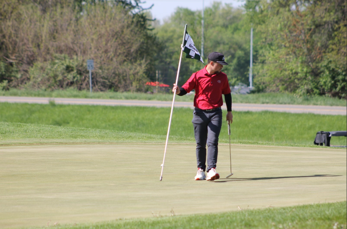 Senior Lucas Brown striding across the Harrison Hills golf course. Photo courtesy of Brooke Johnson