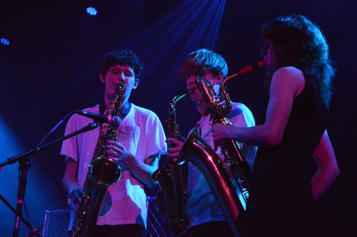 Junior Eli Shaffer, junior Jackson Puls and senior Vivian Arney play brass for Speaking Sheep during the Spring Thing benefit concert on May 3. 