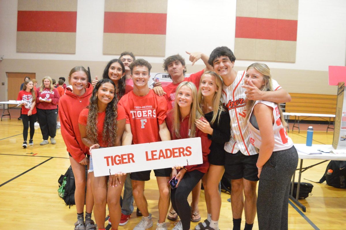 Members of Tiger Cage pose at the Club fair on Aug. 15. This year's group includes seniors Jack Powell, Parker Kurtz, Ethan Luenemann, Elijah Ayugi, Cole Brownell, Breck Guffey, Anya Vaughn, Neela Reddy, Kylie Wilson, Pao Salazar, Ava Tester, and Olivia McNall. 