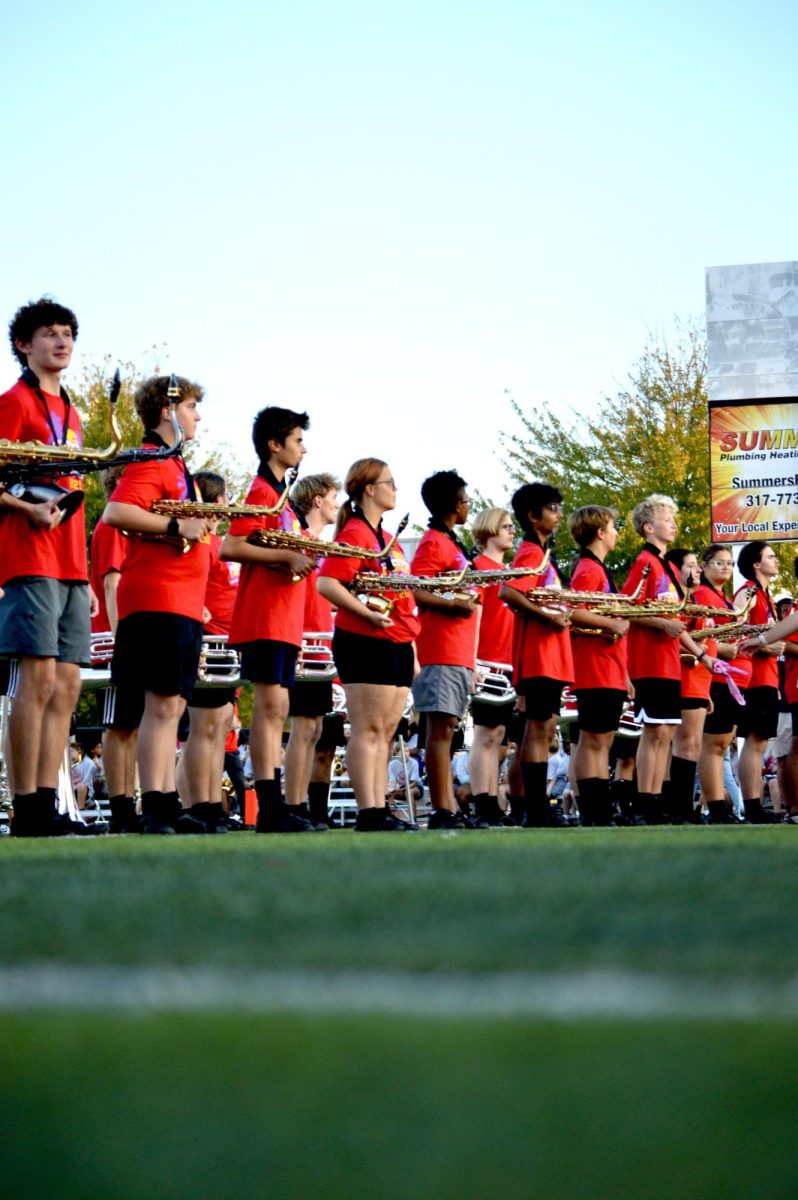 The Fishers Tiger Marching Band lines up as the Varsity Football team runs out onto the field on Oct. 3 at Reynolds Stadium. 