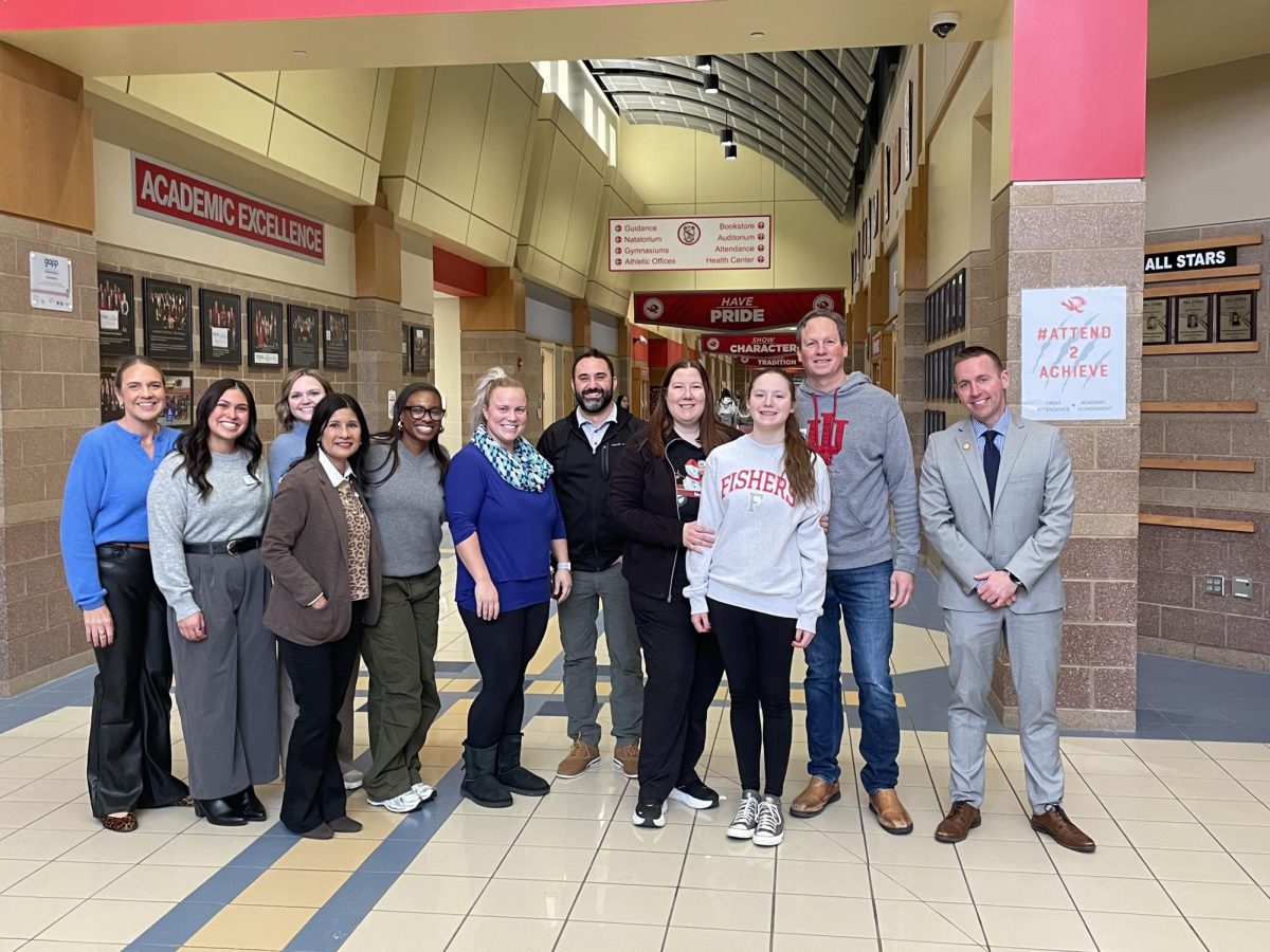 Senior Savannah Greenbaum poses with her family and FHS administration on Dec. 16, 2025. Photo courtesy of Savannah Greenbaum. 