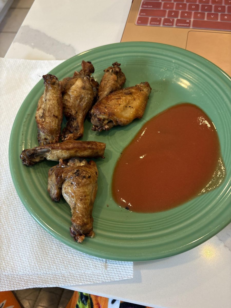 The photo displays a plate of wings from City Barbeque along with Franks Red Hot Sauce. Photo courtesy of Audrey Lieurance.