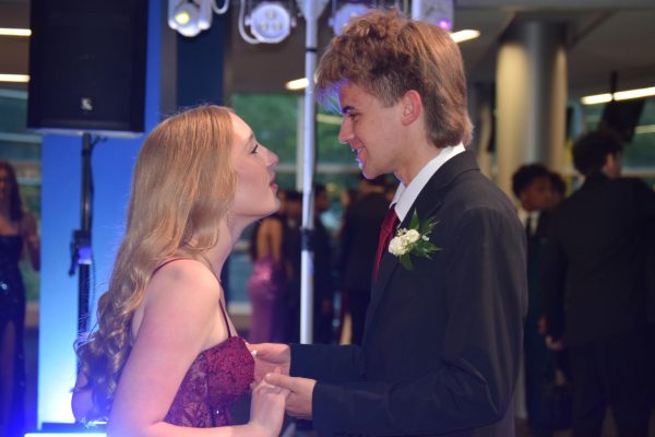 Seniors Reagan Ehret and Eli Clark hold hands on the dance floor at this year’s Prom, themed the Great Gala, at The Children’s Museum of Indianapolis on Saturday, May 9. Both Reagan and Eli shared eye contact. Photo by Jerry Schmidt.