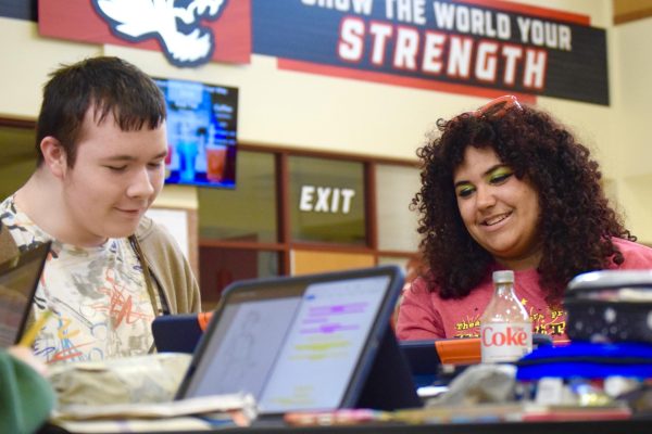 Freshmen Gunner Seely and Sophomore Phoebe Jean-Pierre review Seely’s storyboarding in the CCA on Friday, May 8. Jean-Pierre smiles while looking at Seely’s drawings. Photo by Jerry Schmidt.